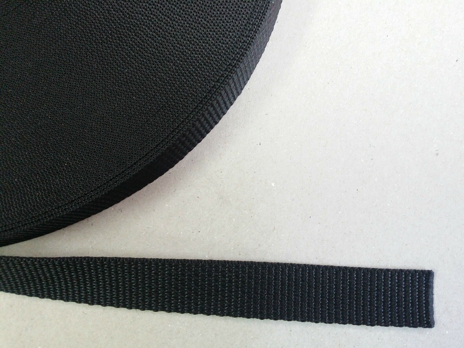 close up of a roll of 20mm webbing showing weave