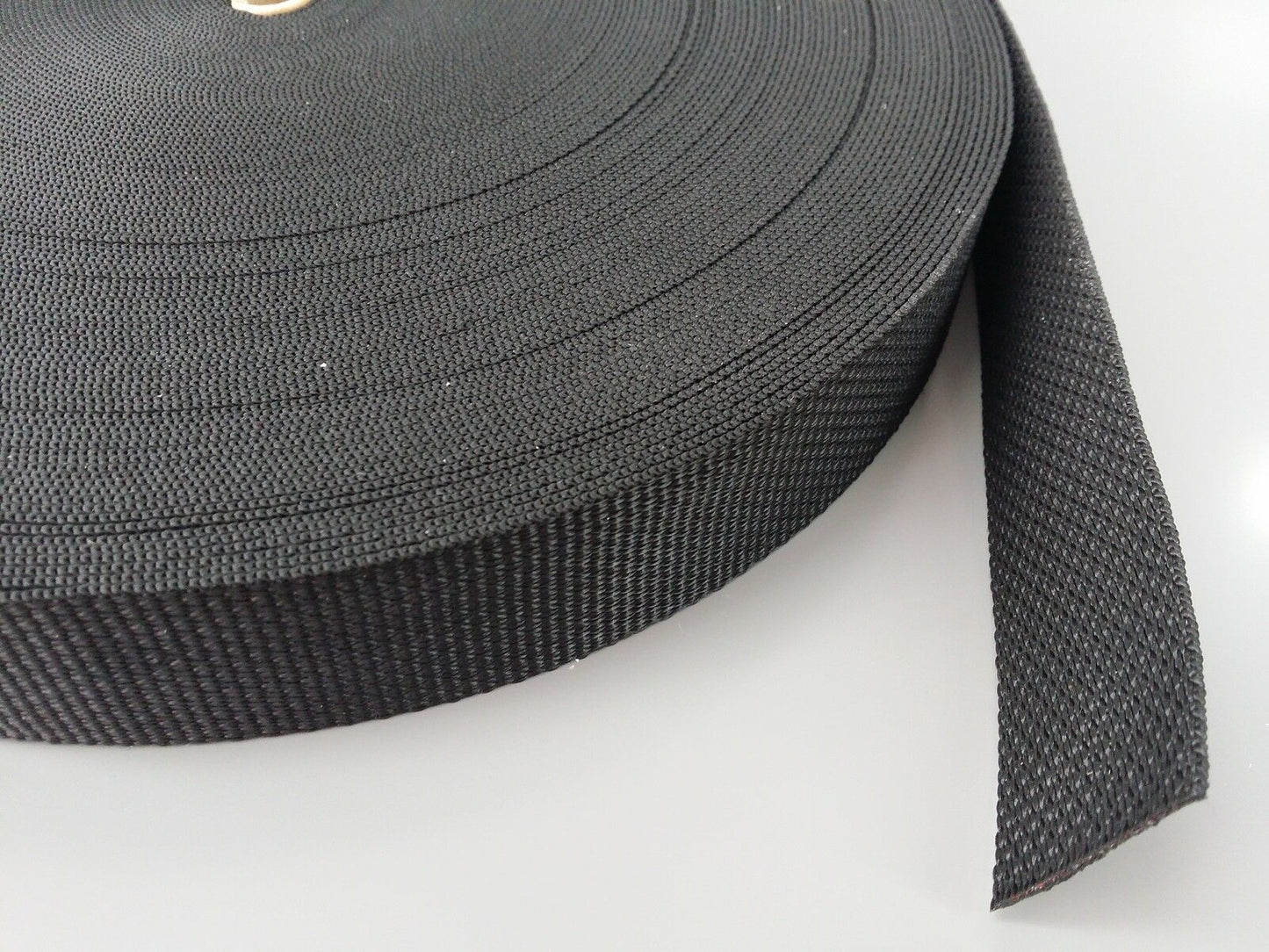 close up of a black roll of webbing