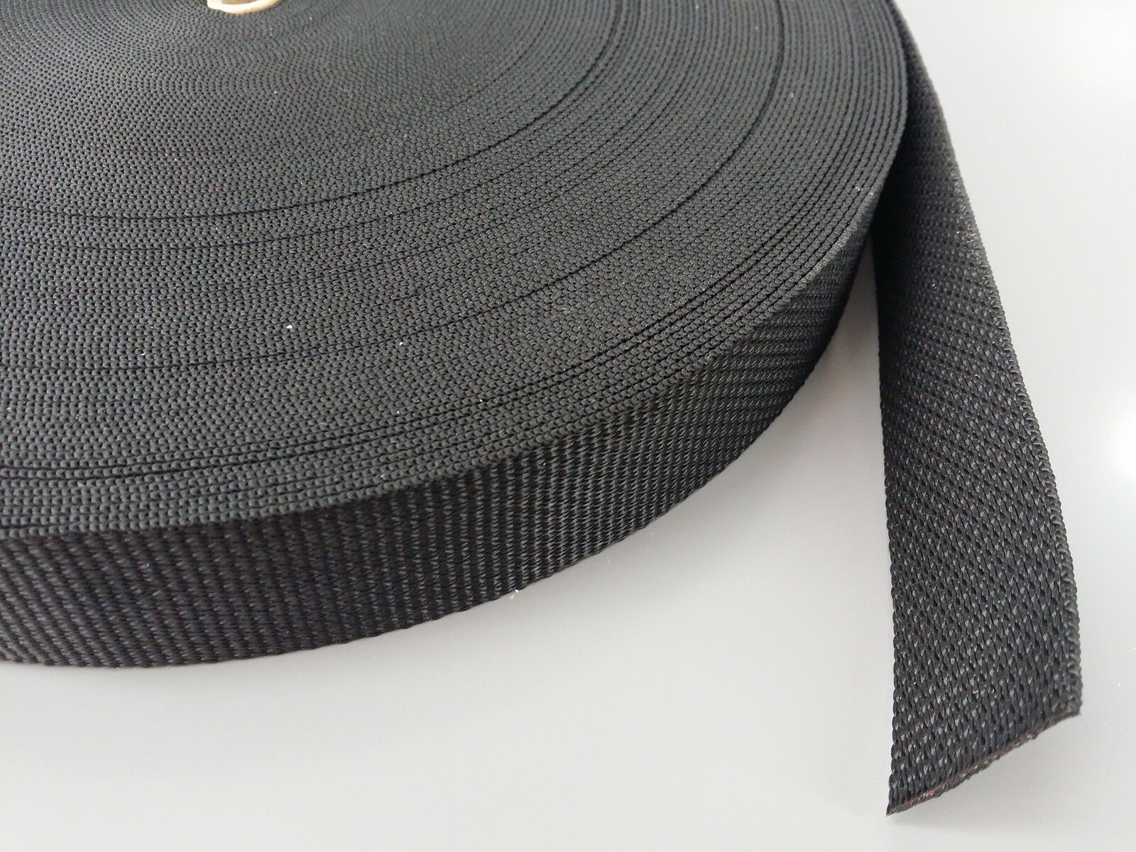close up of a black roll of webbing