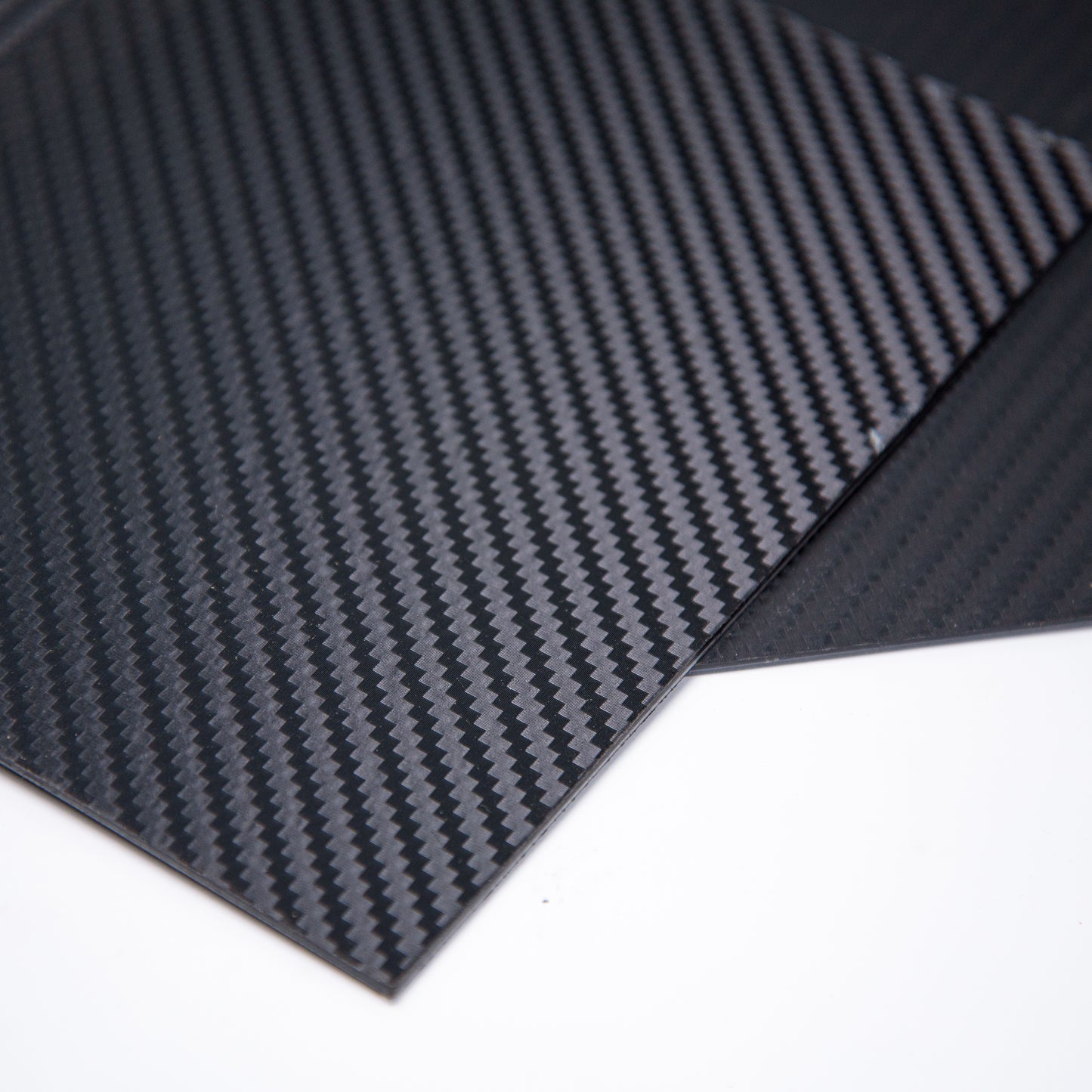 2-peices-of-carbon-fiber-kydex-showing-1-corner
