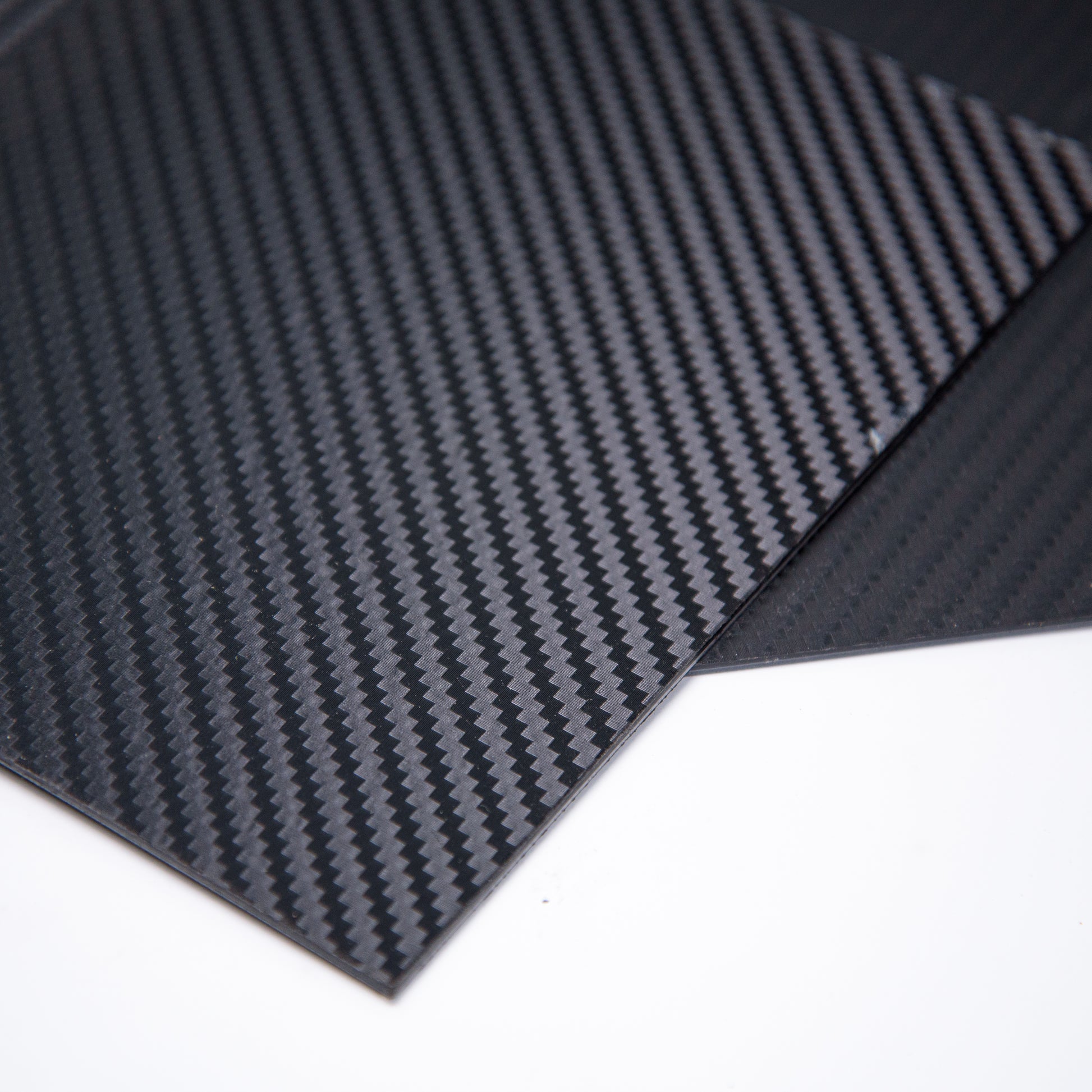 2-peices-of-carbon-fiber-kydex-showing-1-corner